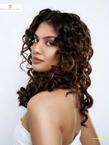 This is what healthy, happy curls look like. I specialize in texture cutting to bring out the natural definition and bounce in your hair, creating a style that’s both beautiful and easy to manage.