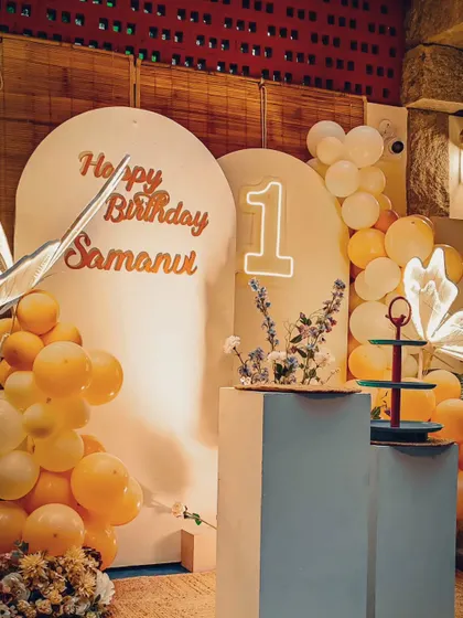 A minimalist and artistic butterfly theme. The clean white backdrops, warm lighting, and glowing butterfly props create a sophisticated and modern look.