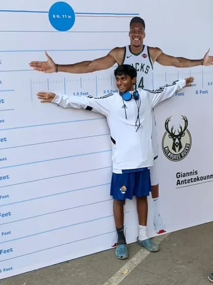 It's all about perspective and big dreams. Another one of our players measures his height against the Greek Freak's cutout. We love seeing our athletes get inspired by the best in the game at these official NBA events.