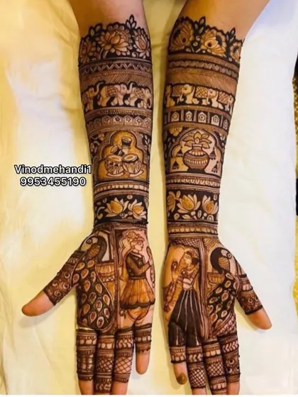 A beautiful combination of divinity and romance. This design features Radha Krishna on the palms, with panels of elephants and lotus flowers on the arms.
