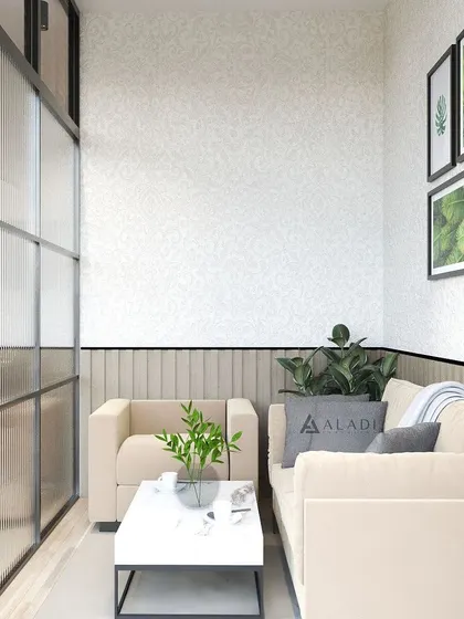 A comfortable and bright waiting or breakout area, designed with neutral tones, plush seating, and biophilic art to create a relaxing space for staff or visitors.