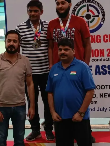 Another group of medalists from the men's competition at the Haryana State Rifle Association event.