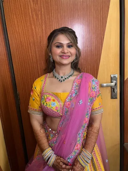 A smiling portrait of the client, looking radiant and happy.