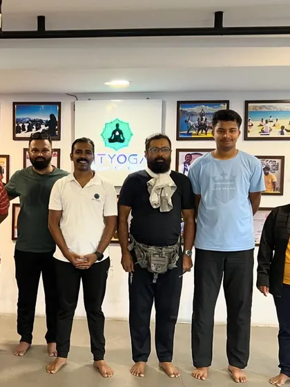 A group of dedicated students posing after a rewarding yoga session.
