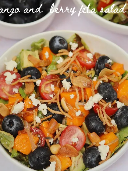 A refreshing Mango and Berry Feta Salad. This dish combines sweet mangoes, juicy berries, and salty feta for a light and flavourful salad that's perfect for summer.