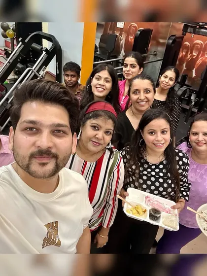 Sharing a meal and a smile during our Paschim Vihar anniversary. It's these moments that build our community.