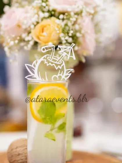 A refreshing drink at a "Coco Baby" shower, complete with a custom coconut-themed stirrer. It's these small, thoughtful details that make an event truly special and cohesive.
