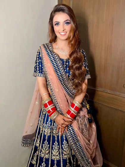 The beautiful Dr. Aarushi ready for her reception. The bold blue eye makeup is the star of this look.