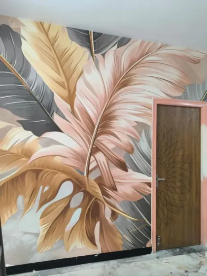 Another view of the large-scale tropical leaf mural, showing how the design transforms the entire wall into a piece of art.