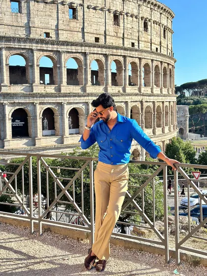 A confident pose in the Viaggio shirt, showcasing its perfect fit and vibrant color that stands out in any setting.