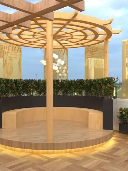 A close-up of the circular wooden gazebo from the Palam Vihar design. This unique structure serves as a central gathering point, with built-in seating and elegant lighting.