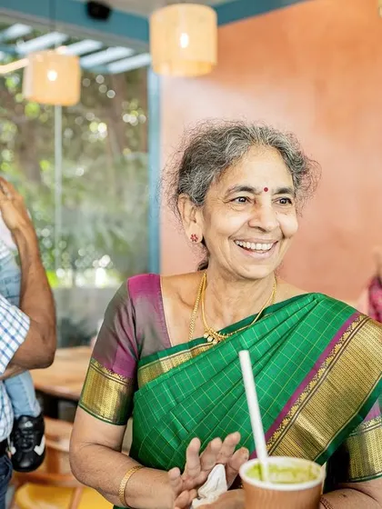 The joy of a grandparent. I love taking candid photos of guests at parties, like this grandmother's beautiful, happy smile as she enjoys the celebration.