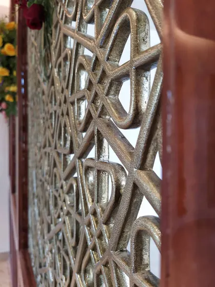 A close-up of a custom brass partition we created for a residential project. These decorative screens are an excellent way to divide spaces while maintaining an open feel and adding a touch of artistic, metallic elegance.