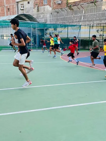 Dynamic warm-ups, including high knees and jogging, to get the players' bodies ready for practice.