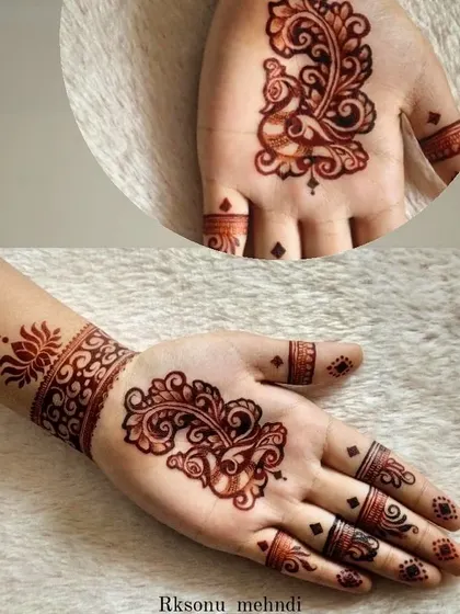 This single, bold paisley motif makes a beautiful statement. Paired with a simple wristband and finger details, it's a perfect example of minimalist art with a traditional touch.