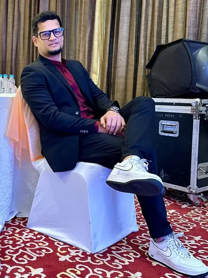 Relaxed and ready to go. My professional sound equipment is visible in the background, all set for the night.