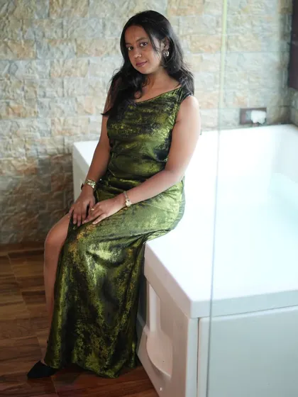 A stylish and affordable option for your next party. This green velvet gown looks much more expensive than its rental price.