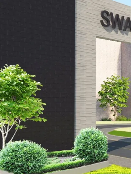 The entrance to Swarnprastha Public School, designed to be modern and welcoming. The combination of dark and light stone cladding creates a bold, clean look for an institution built for tomorrow's leaders.