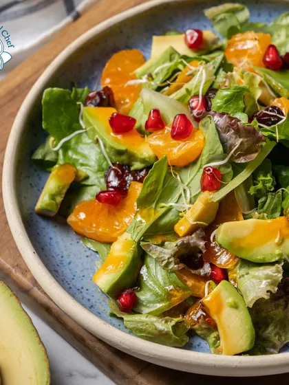 My signature salad, featuring mixed greens, avocado, orange segments, and pomegranate seeds, is a feast for the eyes and the palate. It's the perfect light and refreshing counterpoint to richer dishes.