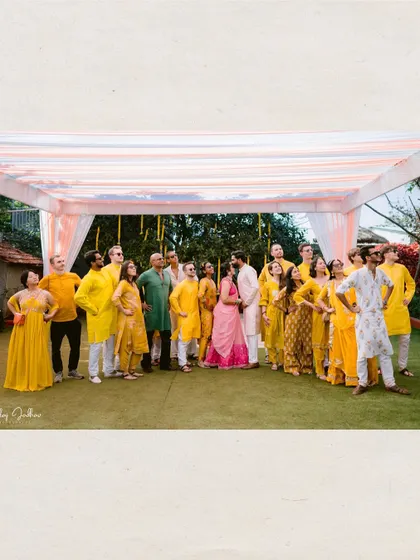 A fun group photo with the couple and their friends, all dressed in festive yellow.