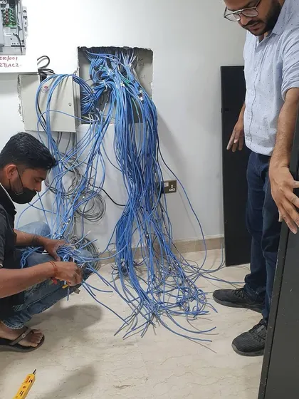 Another view of a complex network wiring project in progress. My job is to sort this out and create a professional server rack setup.