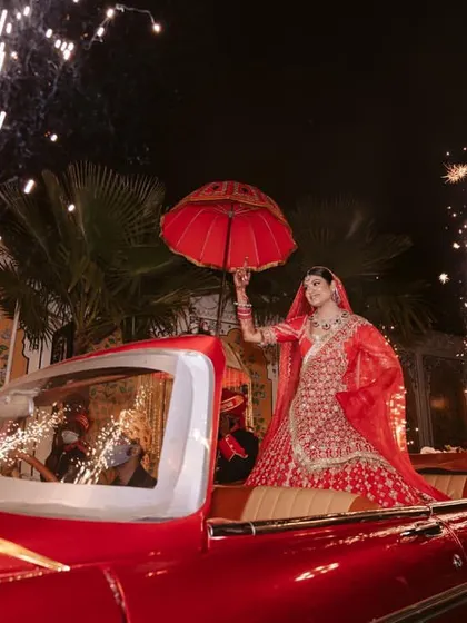 The bride's entry is one of the most anticipated moments. I planned this grand arrival in a vintage car, complete with sparklers, to make sure her first appearance was as glamorous and special as she is.
