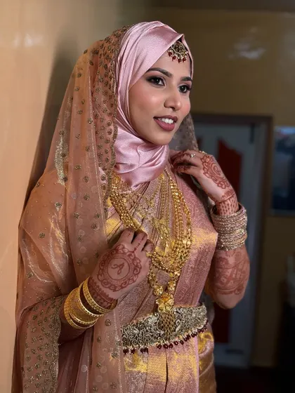 A smiling portrait of the Nikkah bride. Her happiness and confidence shine through, making the look even more beautiful.