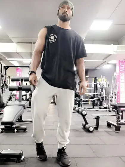 Standing tall in the gym. This is my arena, where I challenge myself every day.