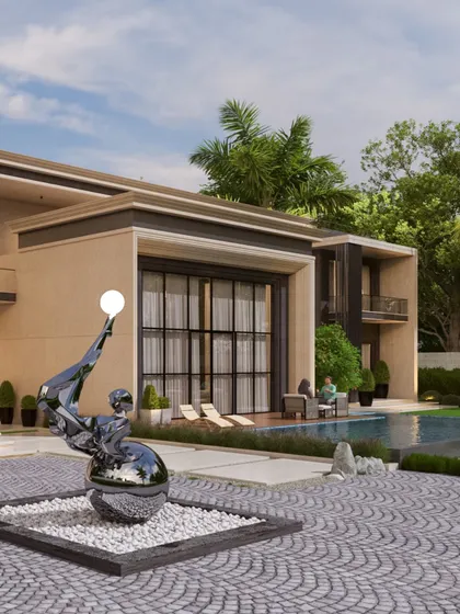 Another view of the contemporary residence highlights a large art sculpture near the driveway and pool. The integration of art into the landscape is a key part of creating a holistic and luxurious living environment.
