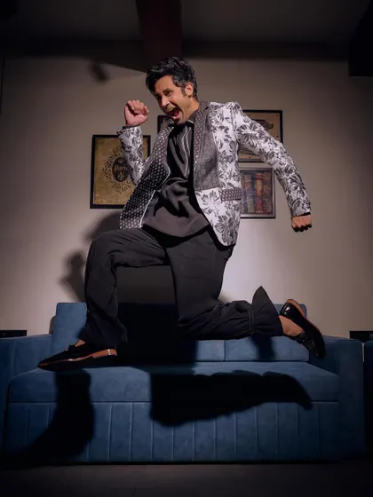 Not just an outfit, but a roar in style. This dynamic shot captures the energy of our black and white floral blazer from the Sukoon collection, a head-turner for any wedding function.