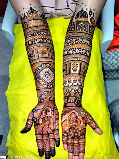 This design combines personalized initials with traditional peacock and elephant figures, offering the best of both worlds.
