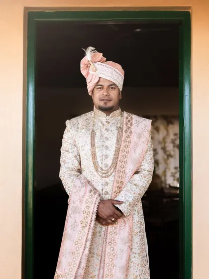 A groom's portrait is just as important as the bride's. I focus on capturing the groom looking his absolute best, highlighting the elegance of his traditional wedding attire.