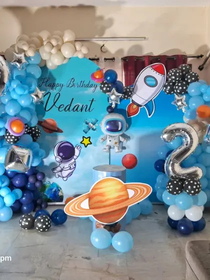 Another angle of the space-themed birthday party, showing the full arrangement in a home setting.