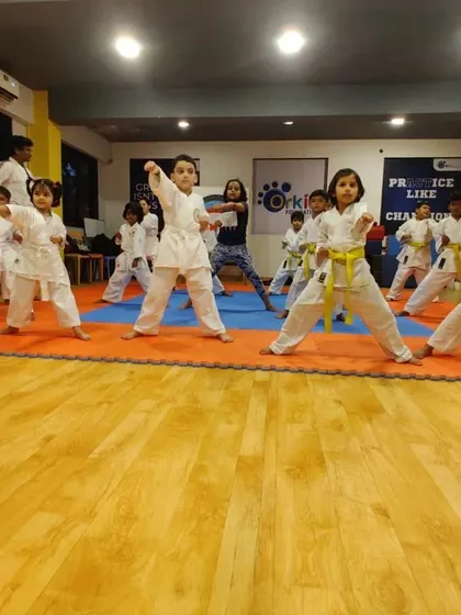 The journey of a thousand miles begins with a single step. Here, our youngest karateka practice their foundational stances and kata forms in a group class, building discipline, focus, and strength from an early age.