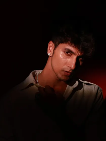 A direct and confident look from the low-key portrait session. The sliver of light catches the model's face, highlighting his expression while keeping the mood dramatic.