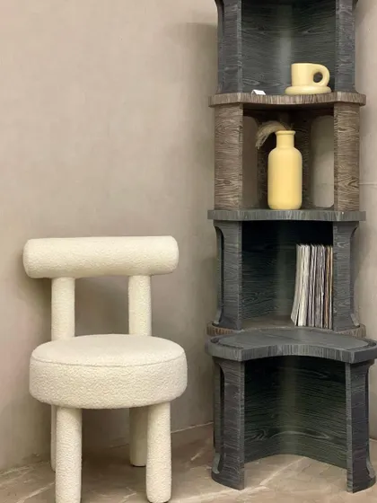 Meet "Stuart," a peculiar and charming accent chair in a cream bouclé fabric. Its unique design makes it a standout addition, reflecting our client's individual taste and personality.