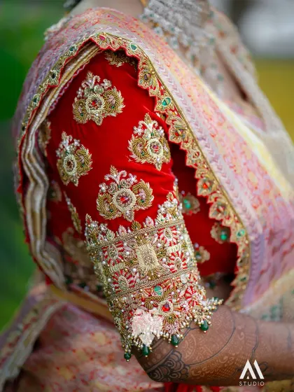 A close-up of the heavy sleeve border on Bhavana's velvet blouse, sealing the royal finish.