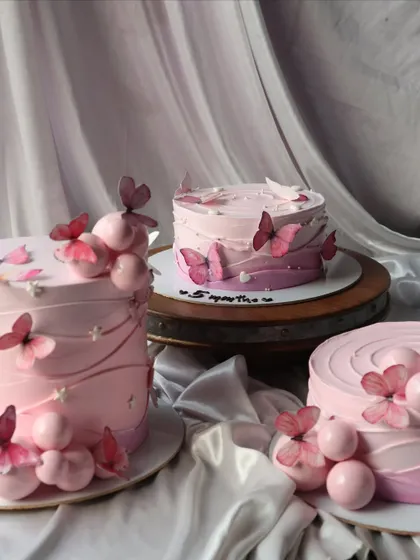 A collection of three of my pink butterfly cakes, each with a slightly different design.
