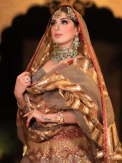 A close-up of the royal bride, showing the intricate details of her passa, nath, and layered necklace.
