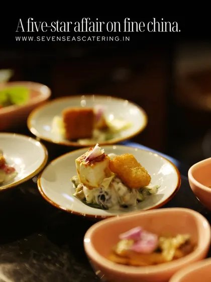 "A five-star affair on fine china." This graphic highlights our commitment to luxury, showing a collection of our elegant small plates and canapés ready to be served.
