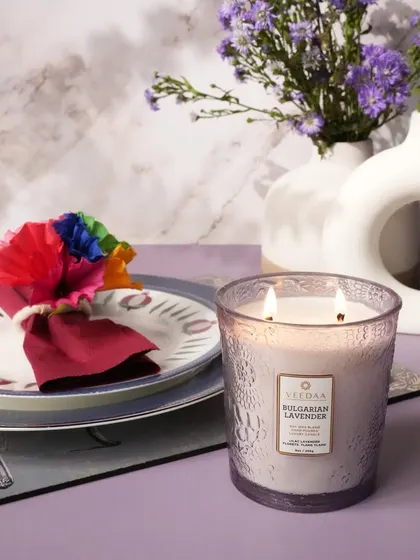 The calming scent of Bulgarian Lavender in our two-wick Valeno glass candle, perfect for creating a serene dinner setting. The hand-cut glass adds a touch of sophistication to your table decor.