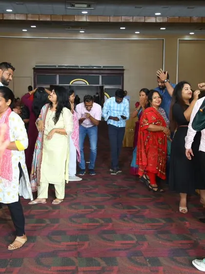 A high-energy moment during a game with parents at the Little Elly school event.