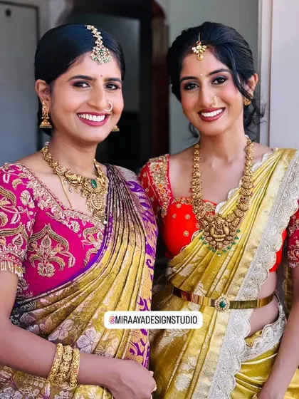 Sister of the bride, Arpita, shines in her own right. I created this vibrant red blouse with heavy gold embroidery to stand out beautifully against her yellow Kanjeevaram saree.