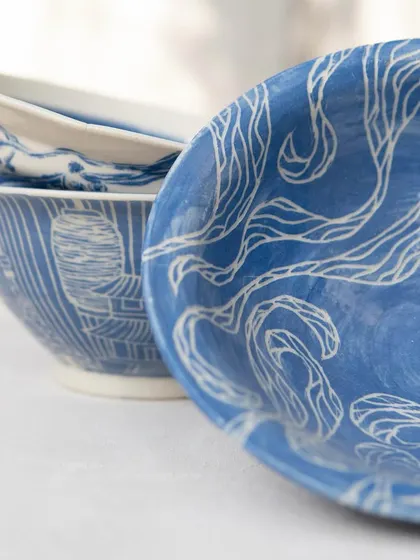 These tastefully made ramen bowls were created by our Foundation students. They are beautifully decorated with detailed sgraffito work inspired by Japanese patterns, landscapes, and culture, turning a functional item into a piece of art.