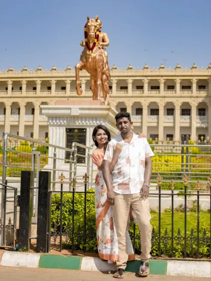 A classic portrait in front of a statue and historic architecture. This type of shot is timeless and documents their love in a significant place.
