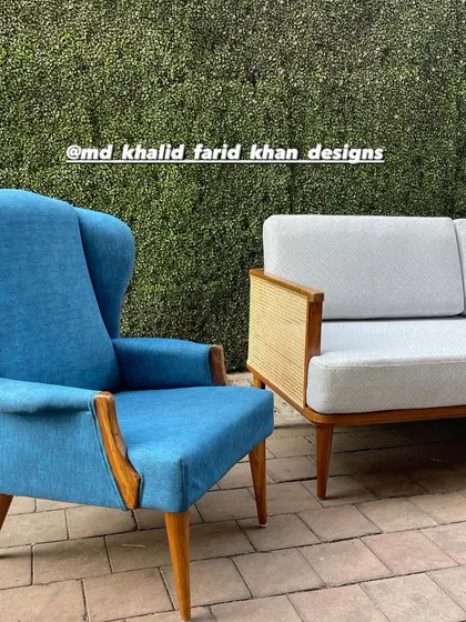 A classic wingback chair upholstered in a bright blue fabric, showcasing my range in traditional chair designs.