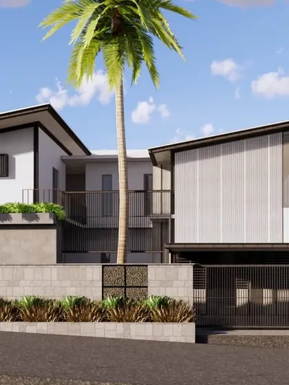This view showcases the symmetrical design of the home's dual entrances. The angled roofs create a sense of balance, while fluted feature walls with gabion cladding add a raw, textural quality to the modern design.