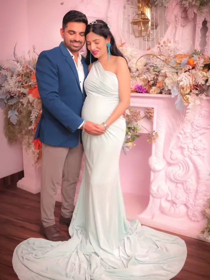 A tender moment where the couple embraces, both gently holding the baby bump. These are the memories you will cherish forever.