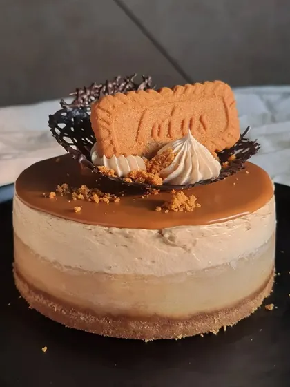 This angle shows the smooth, glossy top layer of Biscoff spread on the cheesecake. The combination of the creamy filling and the spiced cookie flavor is what makes it so addictive.