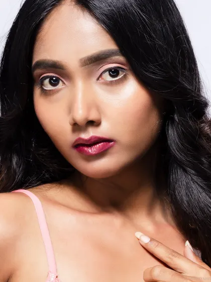 A close-up beauty shot, focusing on the model's makeup.